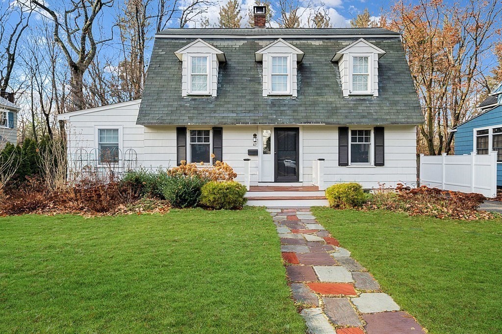 47 Beverly Road Newton, MA 02461 - Photo 2 of 19 a front view of a house with garden