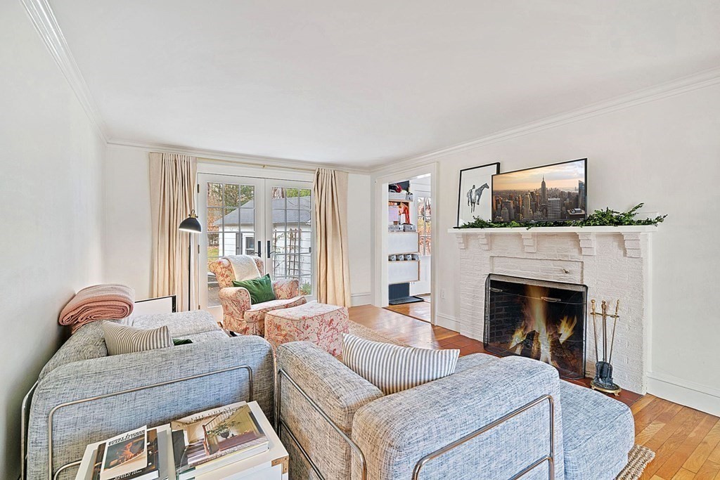 47 Beverly Road Newton, MA 02461 - Photo 6 of 19 a living room with furniture and a fireplace