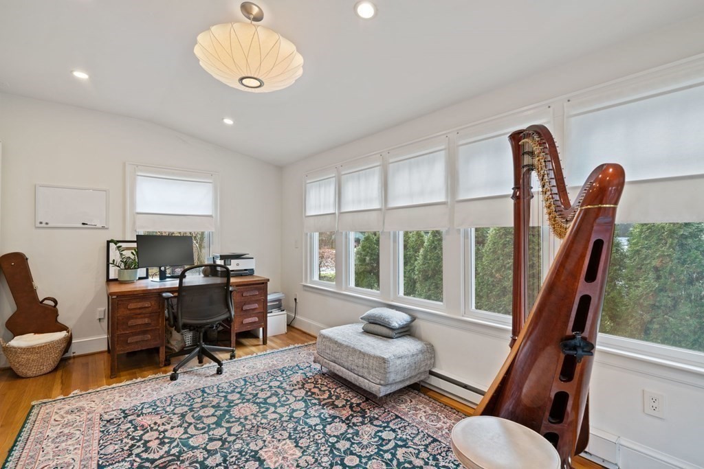 47 Beverly Road Newton, MA 02461 - Photo 10 of 19 a living room with furniture a rug potted plant and a large window