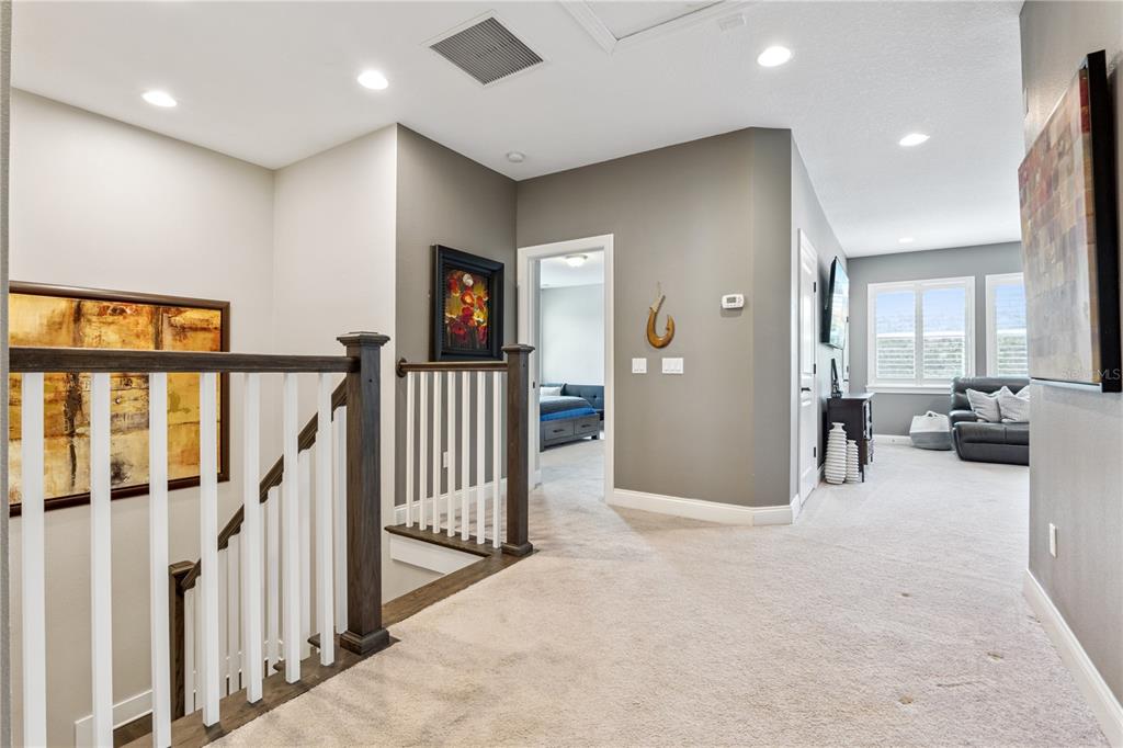 352 Moonbeam Loop Oviedo, FL 32765 - Photo 29 of 64 a view of a livingroom with furniture and stairs