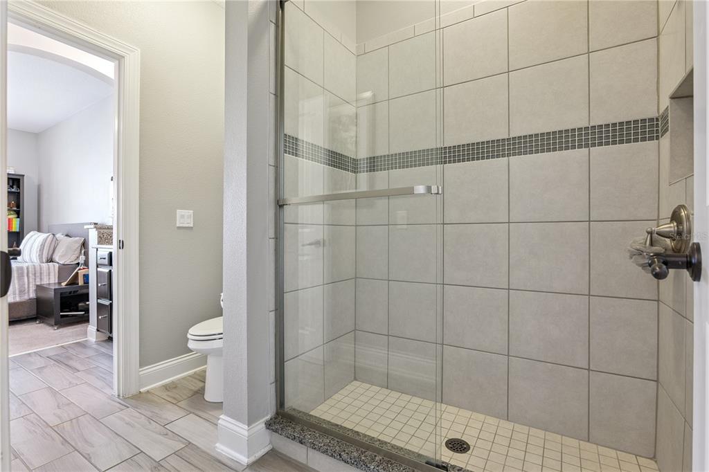 352 Moonbeam Loop Oviedo, FL 32765 - Photo 36 of 64 a bathroom with a sink and a shower