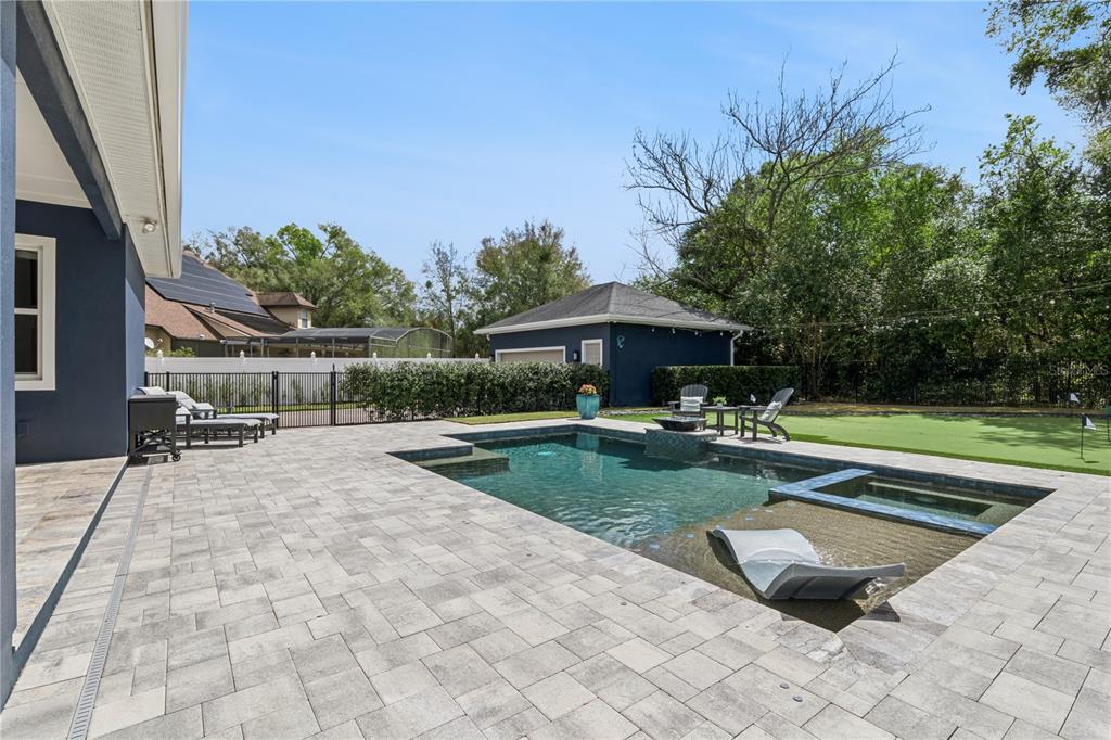 352 Moonbeam Loop Oviedo, FL 32765 - Photo 39 of 64 a view of swimming pool with table and chairs under an umbrella
