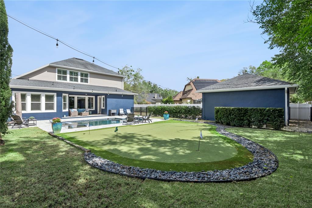 352 Moonbeam Loop Oviedo, FL 32765 - Photo 44 of 64 a view of a house with swimming pool and a yard