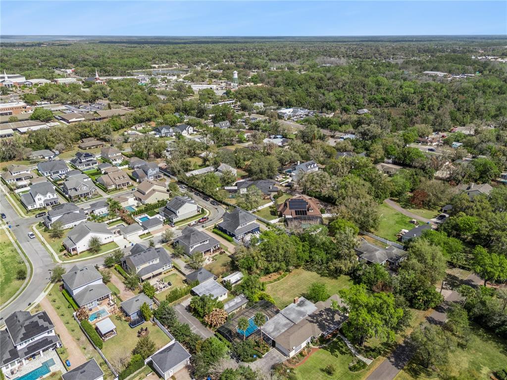 352 Moonbeam Loop Oviedo, FL 32765 - Photo 55 of 64 an aerial view of residential houses with outdoor space and trees