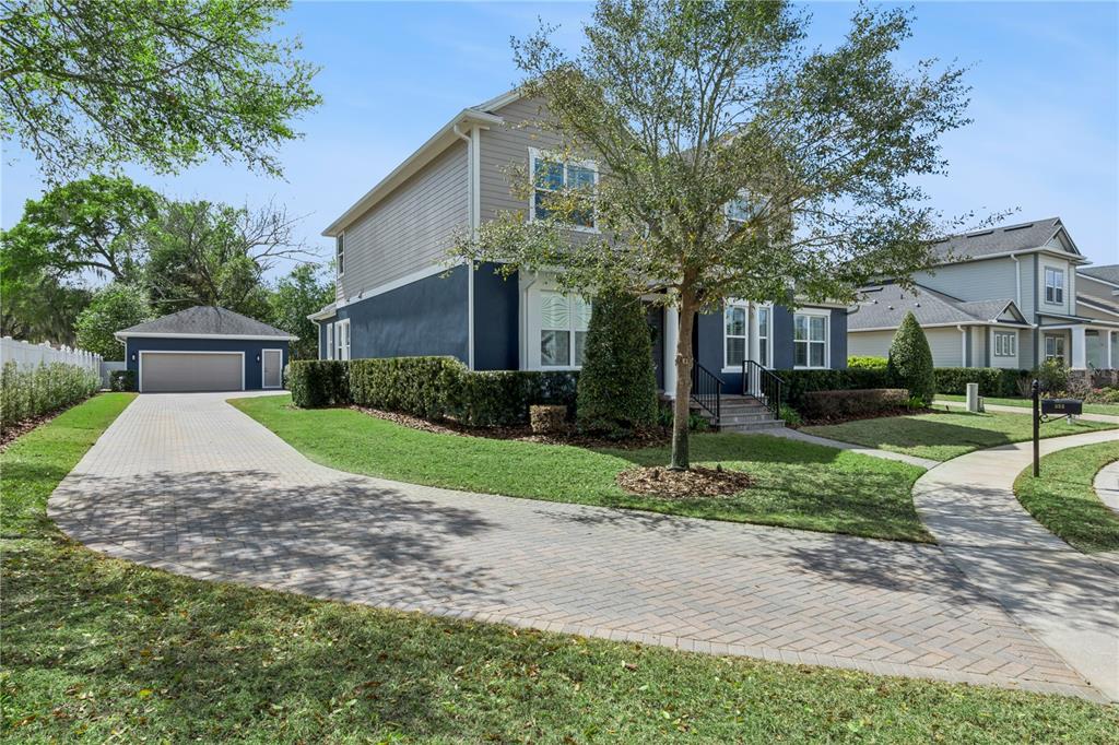 352 Moonbeam Loop Oviedo, FL 32765 - Photo 59 of 64 a front view of a house with a yard and garage