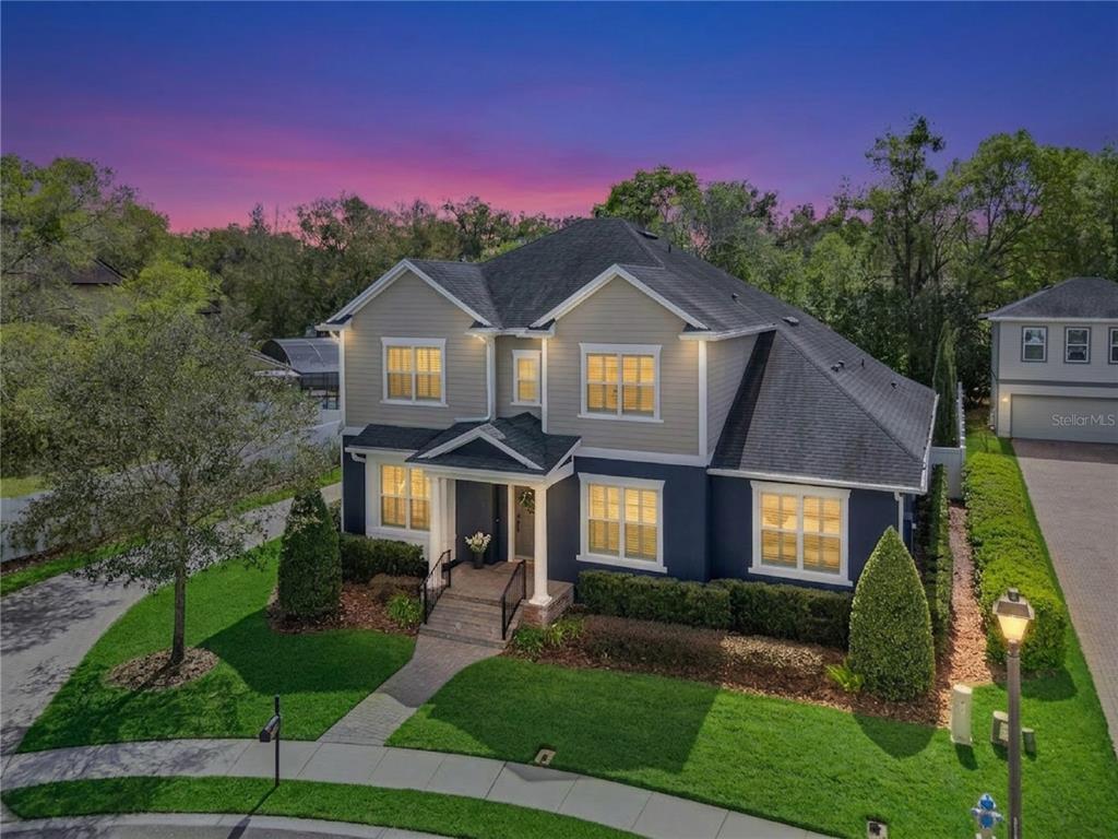 352 Moonbeam Loop Oviedo, FL 32765 - Photo 61 of 64 a front view of a house with a yard