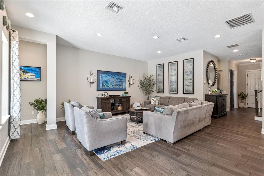 352 Moonbeam Loop Oviedo, FL 32765 - Photo 8 of 64 a living room with furniture and a large window
