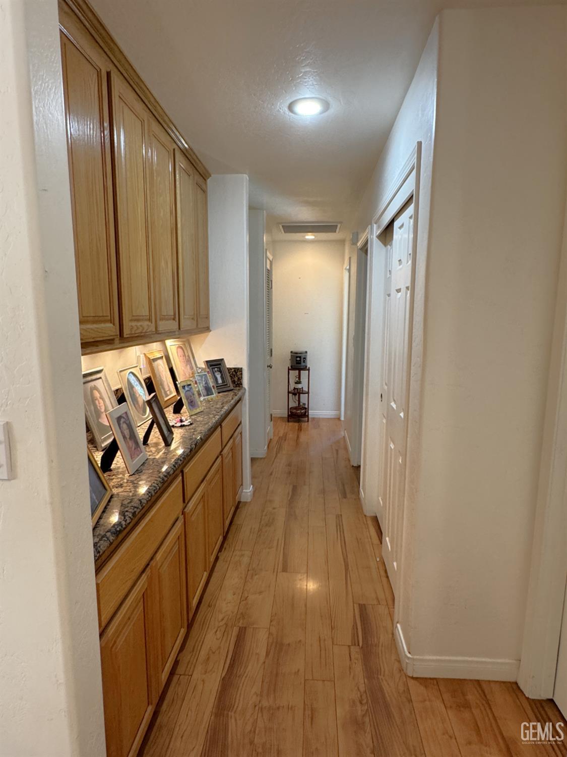 Undisclosed Address Tehachapi, CA 93561 - Photo 8 of 16 a view of a hallway with wooden floor