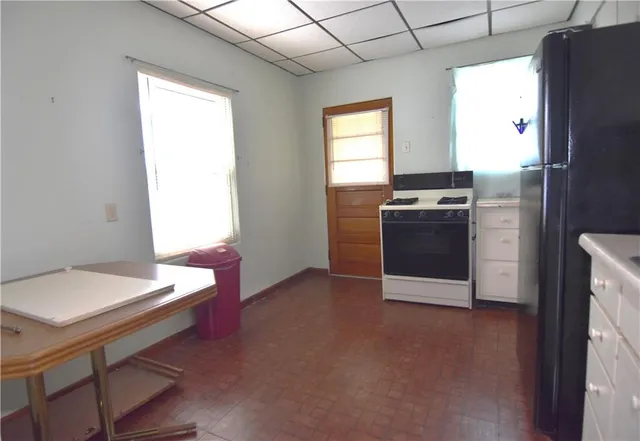 a kitchen with a stove and a refrigerator