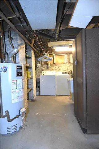 a view of a backyard with plants and wooden fence