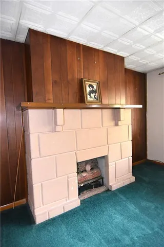 an empty room with a window and a projector