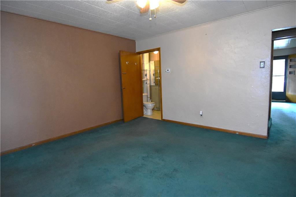 613 East 19th Avenue Homestead, PA 15120 - Photo 9 of 33 an empty room with a window and a projector