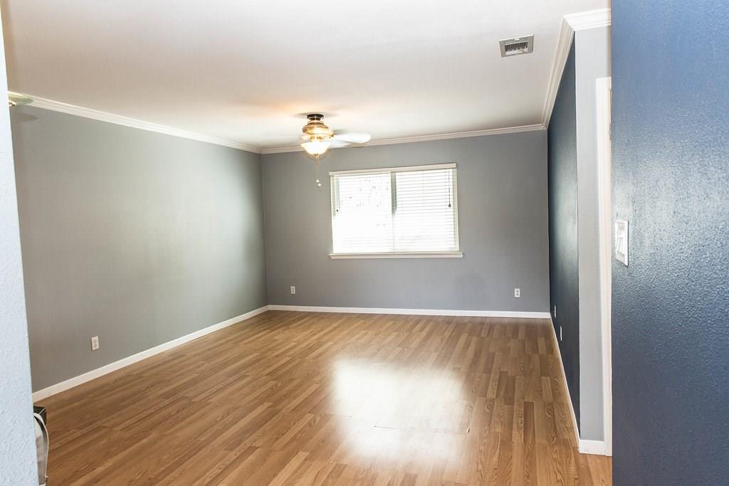 4209 Burnet Road, Unit 206 Austin, TX 78756 - Photo 10 of 20 Laminate flooring and neutral walls define this versatile space, ready for your personal touch.