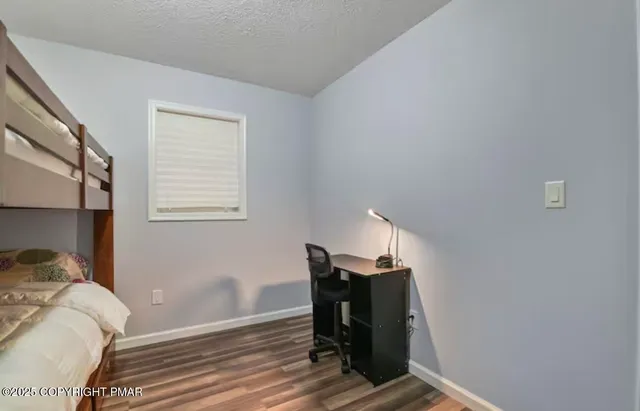 a view of a livingroom with furniture and wooden floor