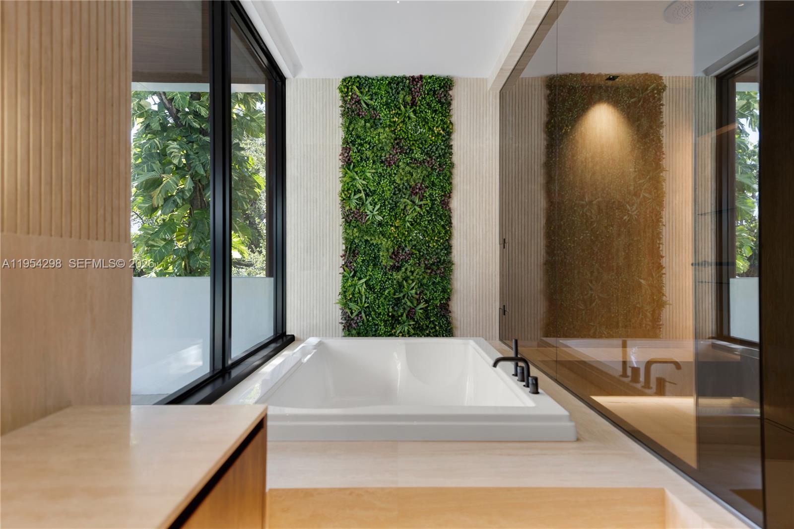 3210 Coacoochee Street Miami, FL 33133 - Photo 16 of 29 a bathroom with a tub and a large mirror