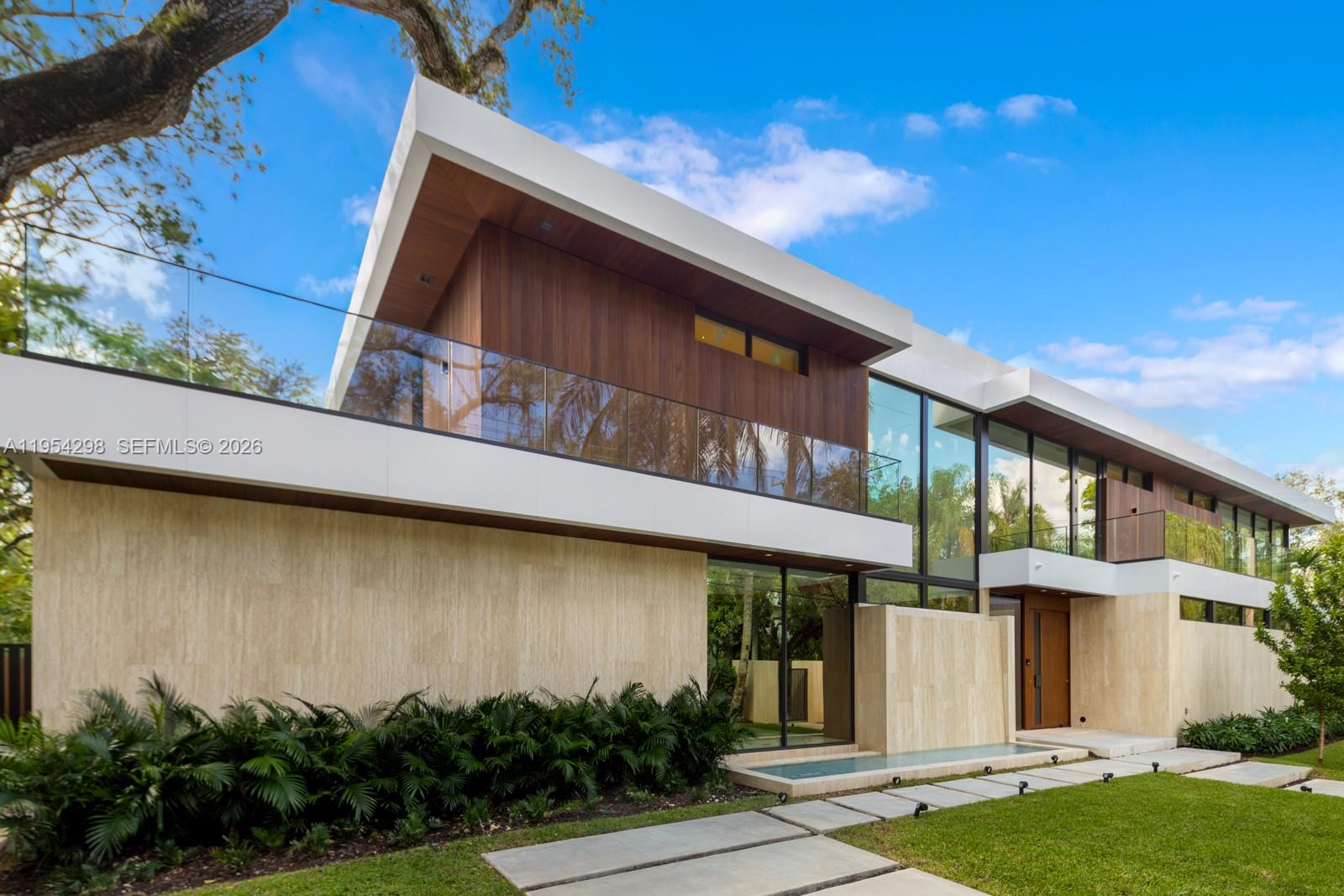 3210 Coacoochee Street Miami, FL 33133 - Photo 25 of 29 a front view of a house with garden