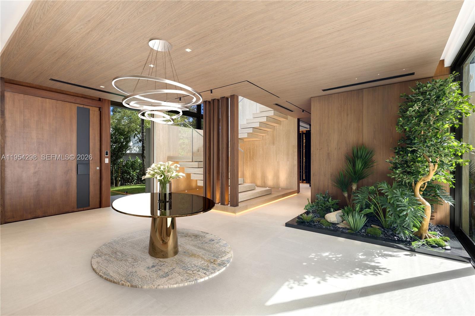 3210 Coacoochee Street Miami, FL 33133 - Photo 5 of 29 a vase of flowers sitting on a table in front of a window