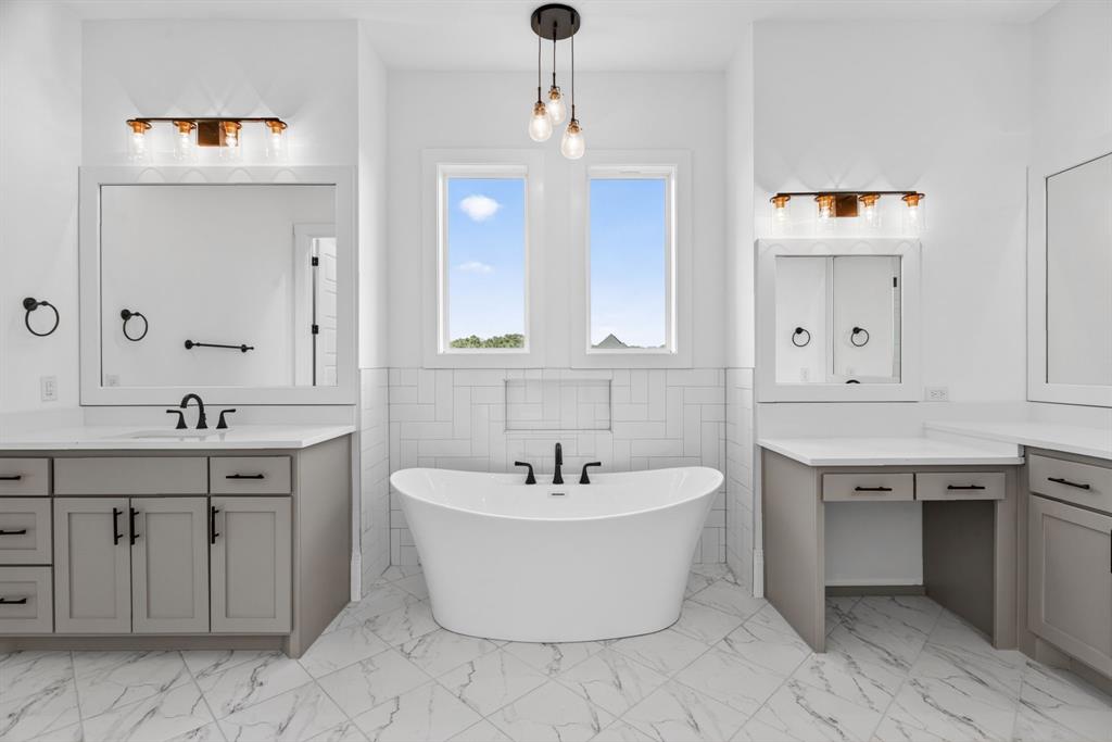 7798 Barber Rnch Road Fort Worth, TX 76126 - Photo 25 of 40 a spacious bathroom with a double vanity sink mirror and bathtub