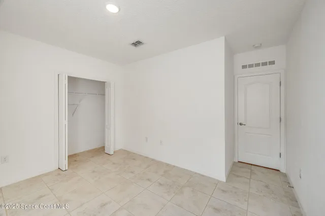 a bathroom with a granite countertop sink a toilet and bathtub