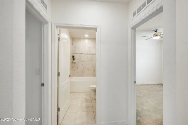 a view of room with window and ceiling fan