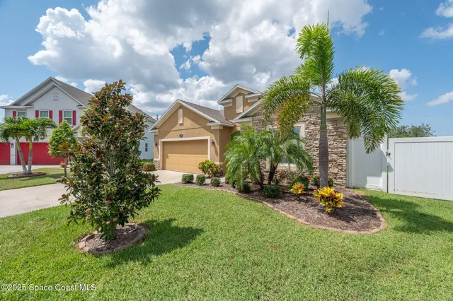 an aerial view of a house with a ocean view