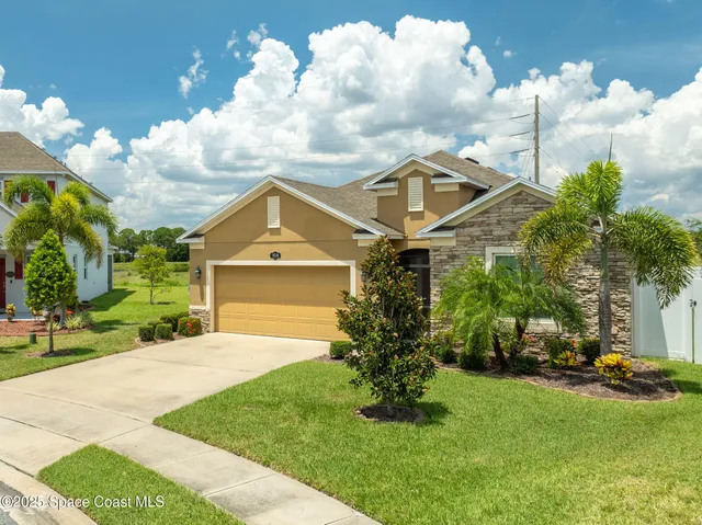 a aerial view of a house with a ocean view