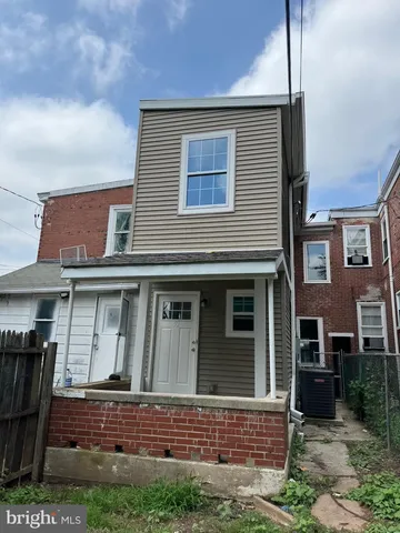a view of brick house with large windows