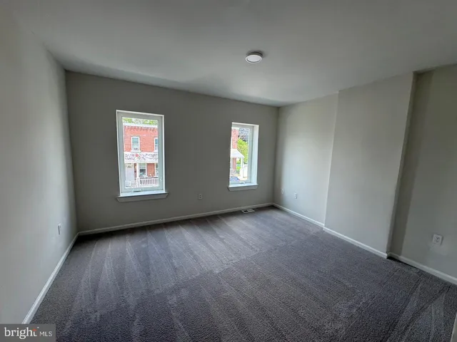an empty room with windows