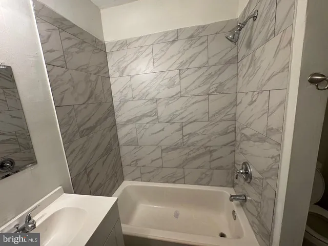 a bathroom with a sink and a bathtub