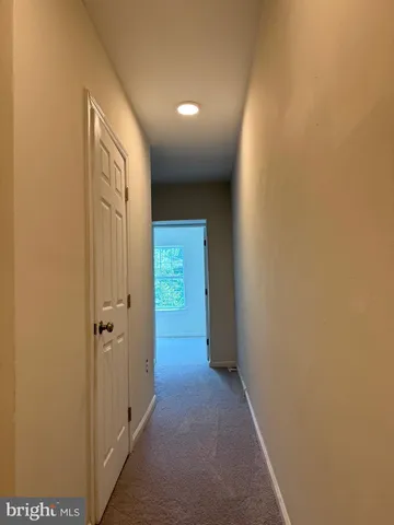 a view of hallway with closet