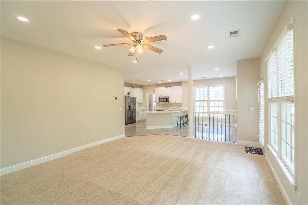 3819 Meandering Way Southwest Lilburn, GA 30047 - Photo 11 of 27 a view of a livingroom with a ceiling fan and window
