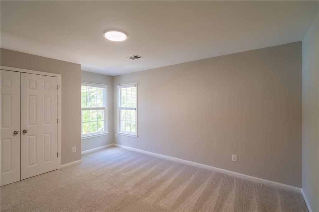 3819 Meandering Way Southwest Lilburn, GA 30047 - Photo 20 of 27 a view of an empty room with a window