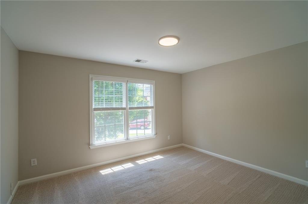 3819 Meandering Way Southwest Lilburn, GA 30047 - Photo 21 of 27 an empty room with a window
