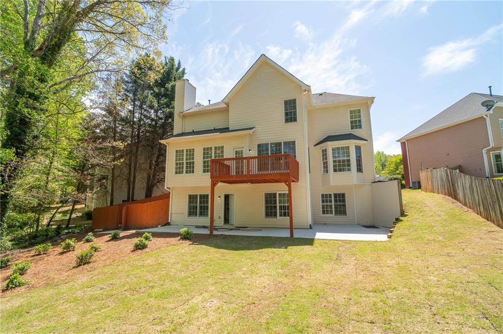 3819 Meandering Way Southwest Lilburn, GA 30047 - Photo 26 of 27 a view of a house with snow on the background