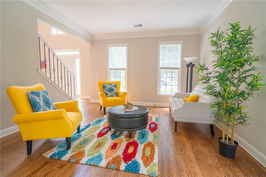 3819 Meandering Way Southwest Lilburn, GA 30047 - Photo 4 of 27 a living room with furniture and a potted plant