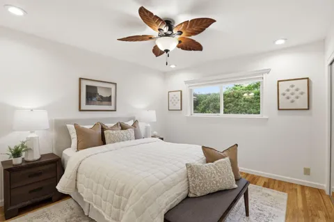 a bedroom with a bed and window