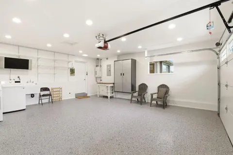 a view of a livingroom with furniture and a flat screen tv