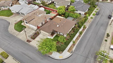 an aerial view of a house with a garden