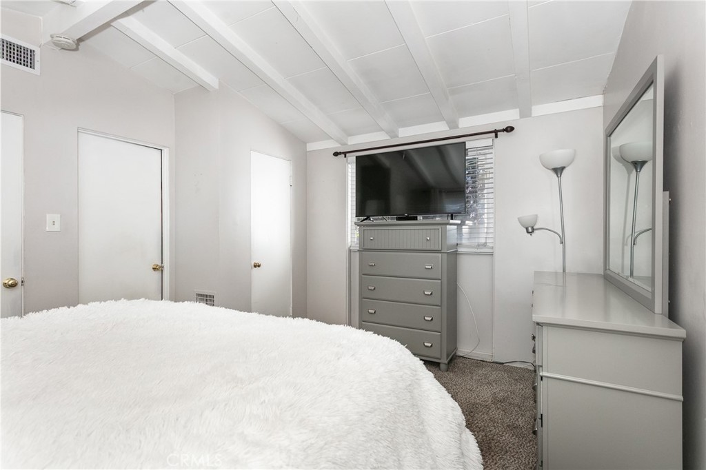20626 Haynes Street Winnetka, CA 91306 - Photo 12 of 28 a bedroom with a bed and a flat screen tv