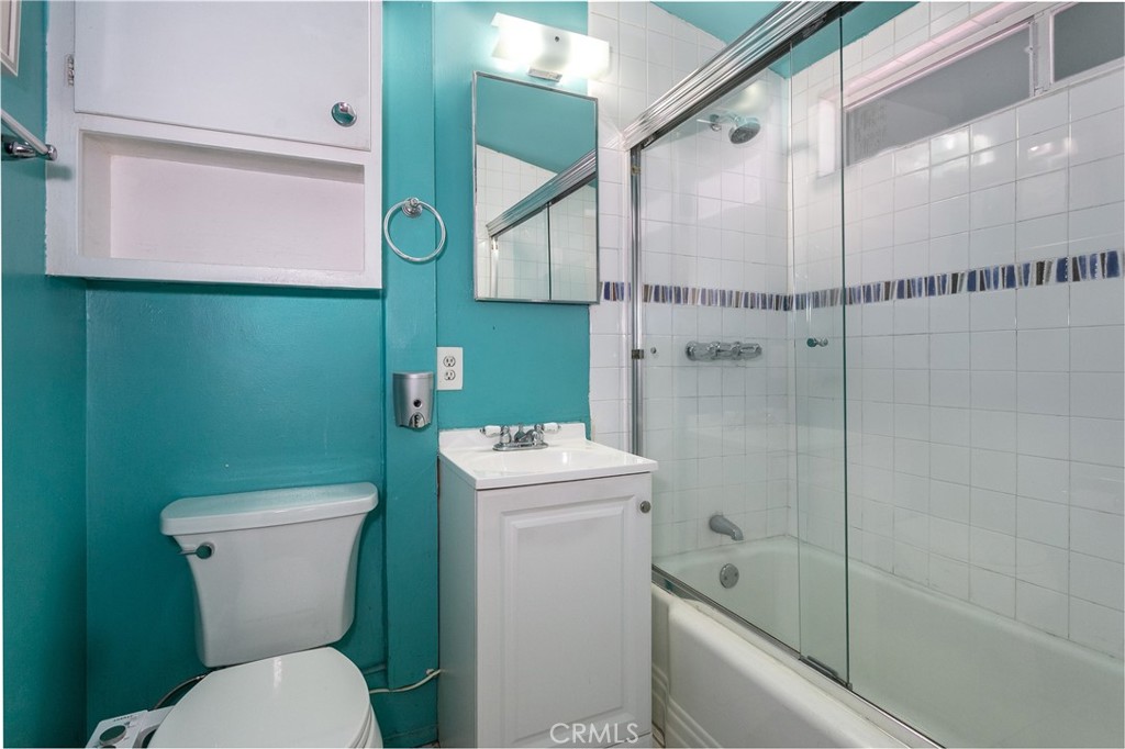 20626 Haynes Street Winnetka, CA 91306 - Photo 13 of 28 a bathroom with a sink a toilet and shower