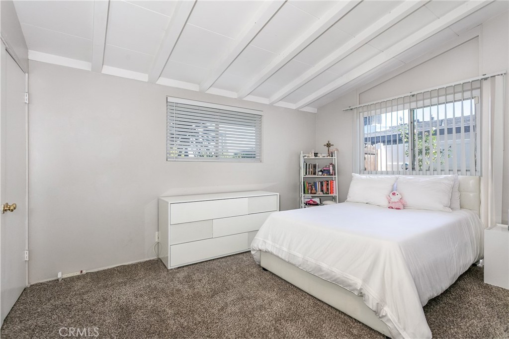 20626 Haynes Street Winnetka, CA 91306 - Photo 14 of 28 a bedroom with a bed and a window