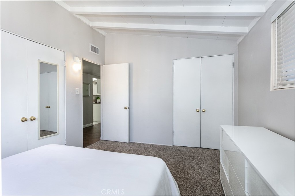 20626 Haynes Street Winnetka, CA 91306 - Photo 15 of 28 a bedroom with a bed and a window