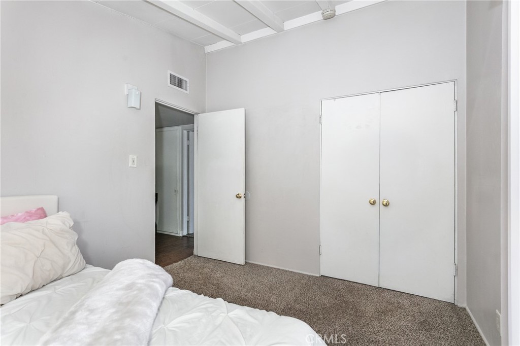 20626 Haynes Street Winnetka, CA 91306 - Photo 18 of 28 a bedroom with a bed and a closet