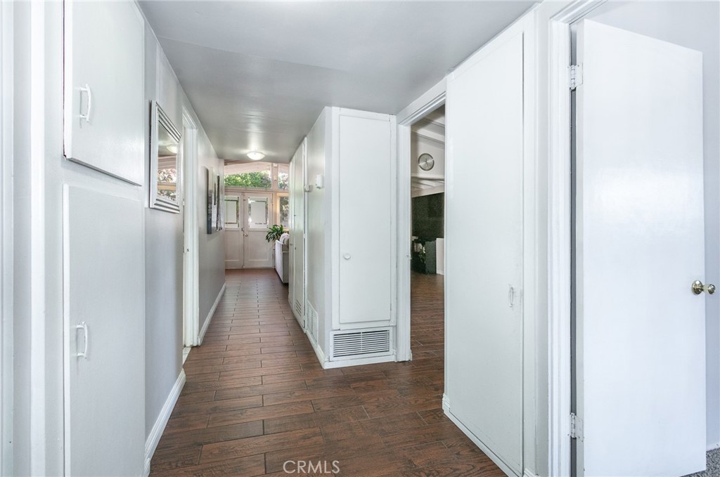 20626 Haynes Street Winnetka, CA 91306 - Photo 20 of 28 a view of a hallway with a wooden floors