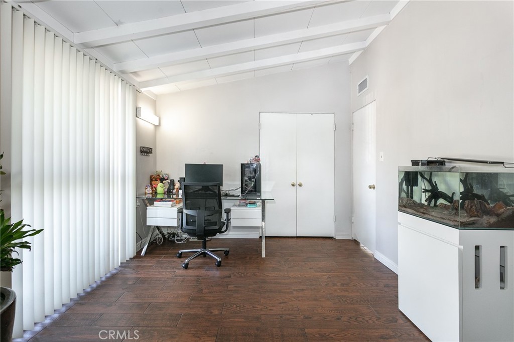 20626 Haynes Street Winnetka, CA 91306 - Photo 21 of 28 a view of a workspace with furniture and a window