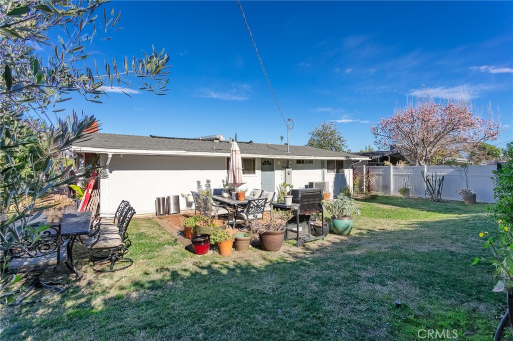 20626 Haynes Street Winnetka, CA 91306 - Photo 27 of 28 a view of a chairs and tables in the back yard of the house
