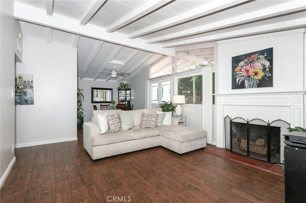 20626 Haynes Street Winnetka, CA 91306 - Photo 5 of 28 a living room with furniture and a fireplace