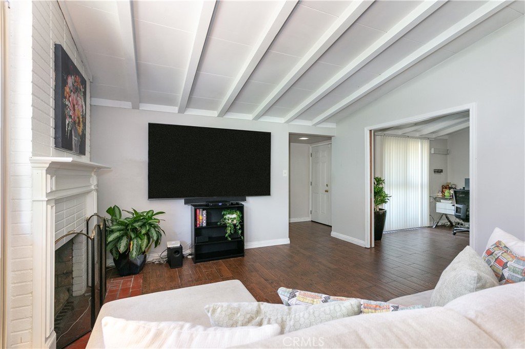 20626 Haynes Street Winnetka, CA 91306 - Photo 8 of 28 a living room with furniture and a flat screen tv