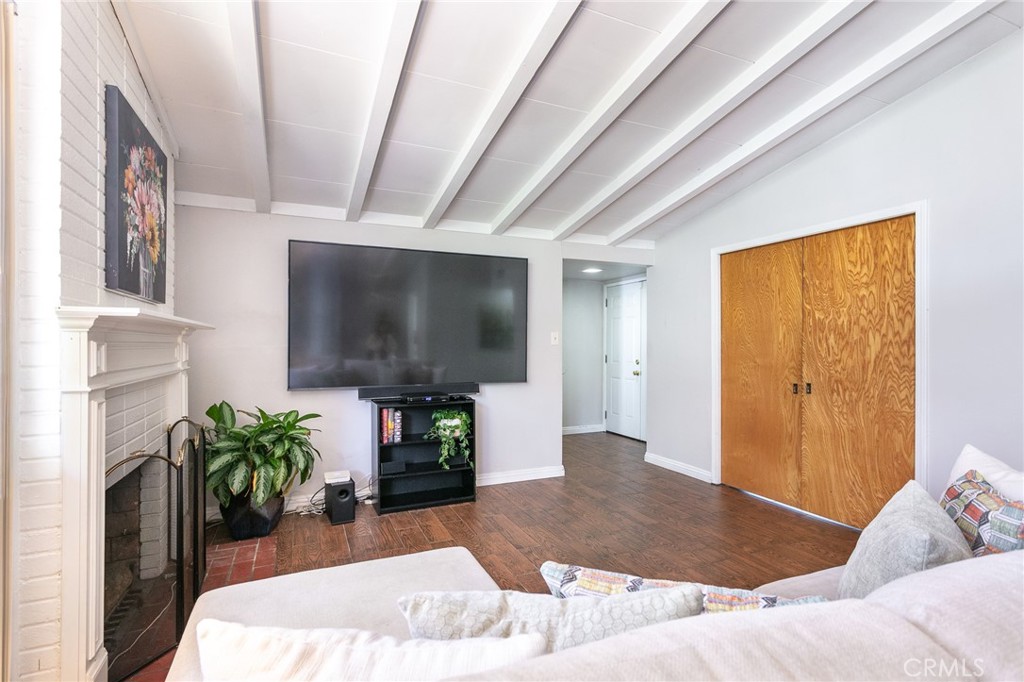20626 Haynes Street Winnetka, CA 91306 - Photo 9 of 28 a living room with furniture and a flat screen tv
