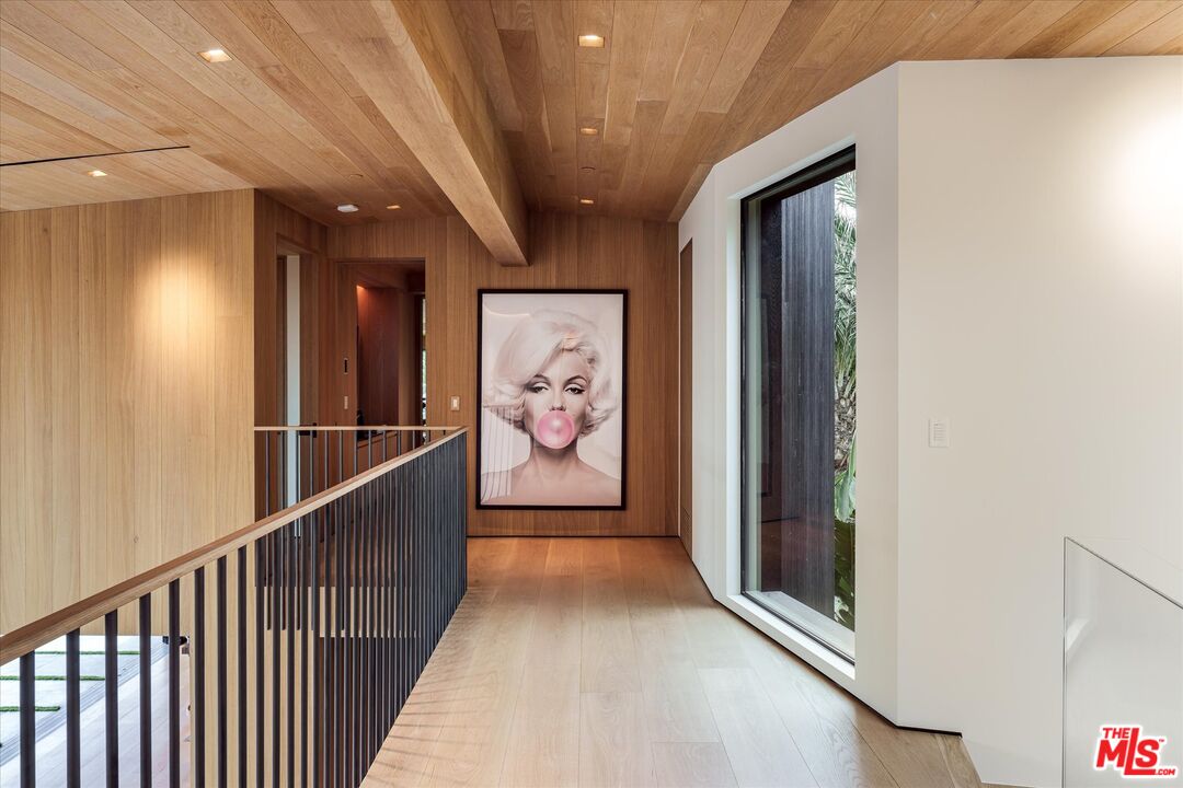 1663 Summitridge Drive Beverly Hills, CA 90210 - Photo 14 of 22 a view of gallery with stairs